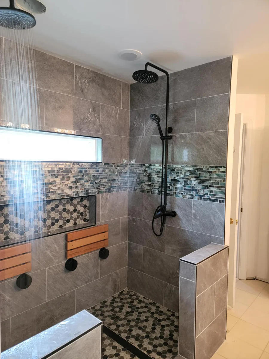 Master bathroom renovation with freestanding tub and custom tile
