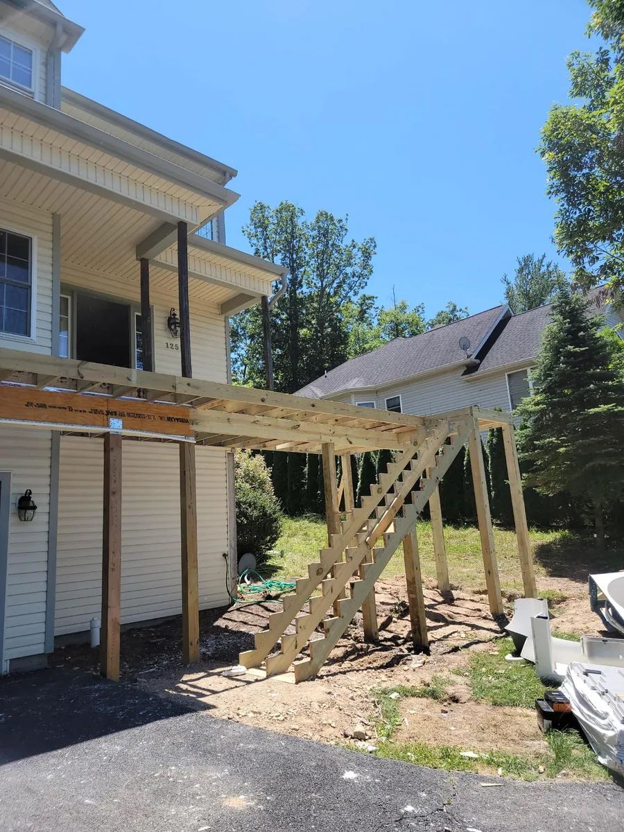 Custom composite deck with pergola and outdoor seating area