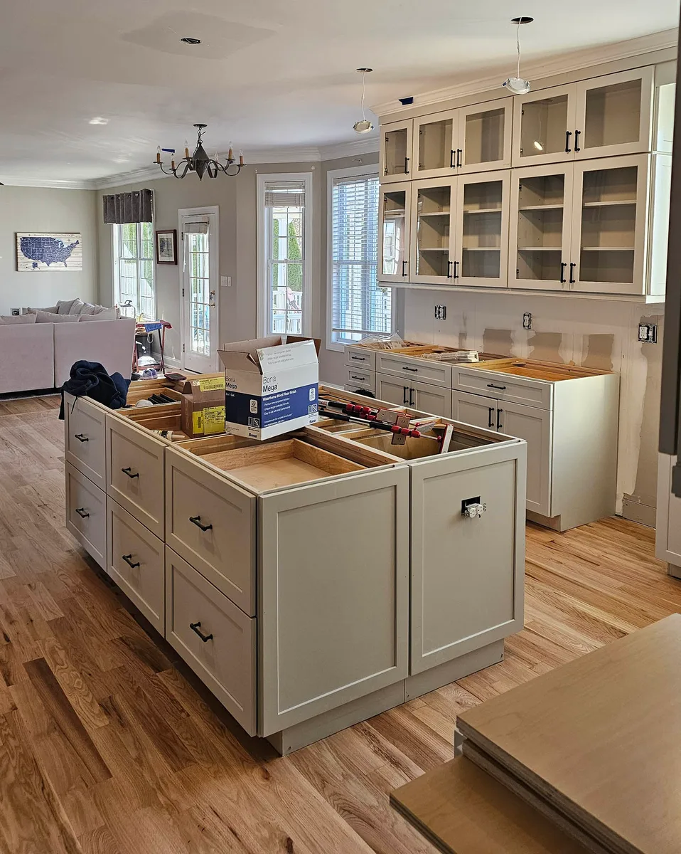 Kitchen renovation with new lighting and tile backsplash