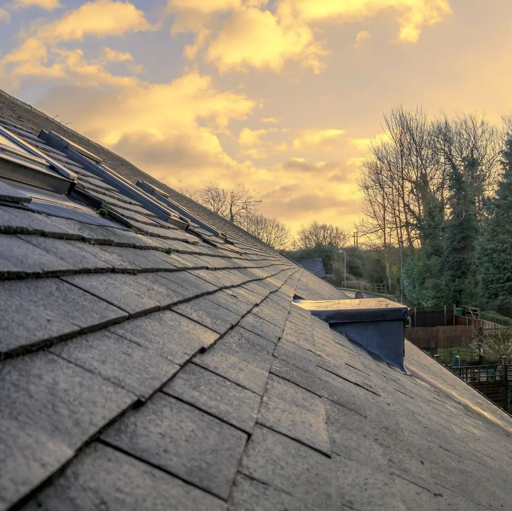 Roofing installation with new flashing and ridge cap